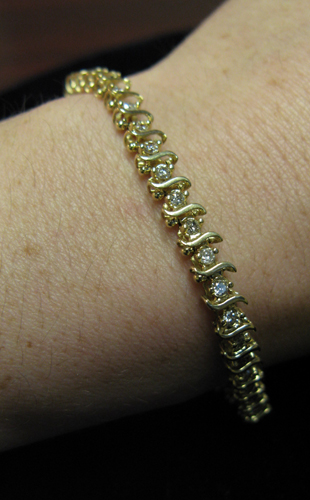 Appraisal: DIAMOND AND FOURTEEN KARAT GOLD BRACELET - inches in length