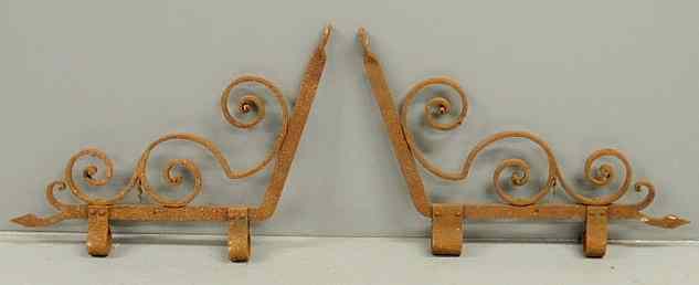 Appraisal: Pair of decorative scrolled wrought iron brackets or arms x