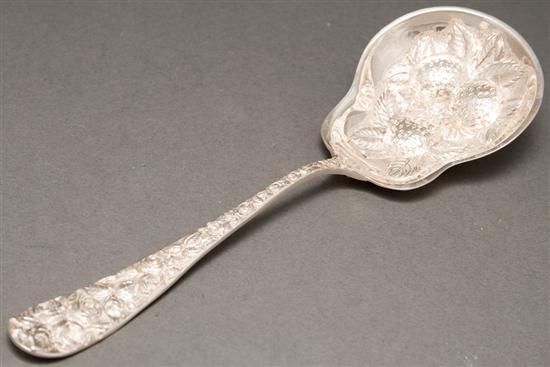 Appraisal: American repousse silver berry spoon in the Baltimore Rose pattern