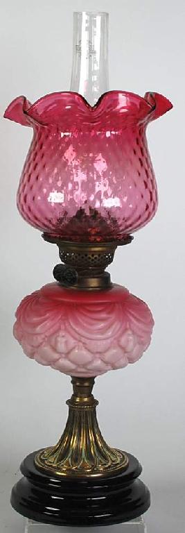 Appraisal: EARLY TWENTIETH CENTURY CRANBERRY GLASS AND BRASS OIL TABLE LAMP