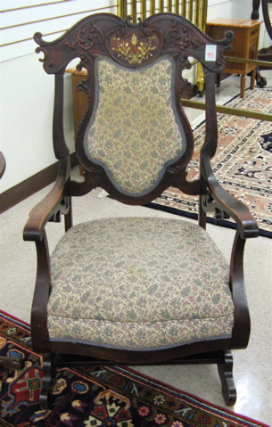 Appraisal: MAHOGANY PLATFORM ROCKER American c the back having a carved