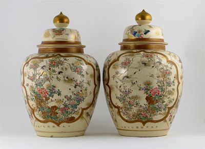 Appraisal: A large pair of Japanese Satsuma vases and covers decorated