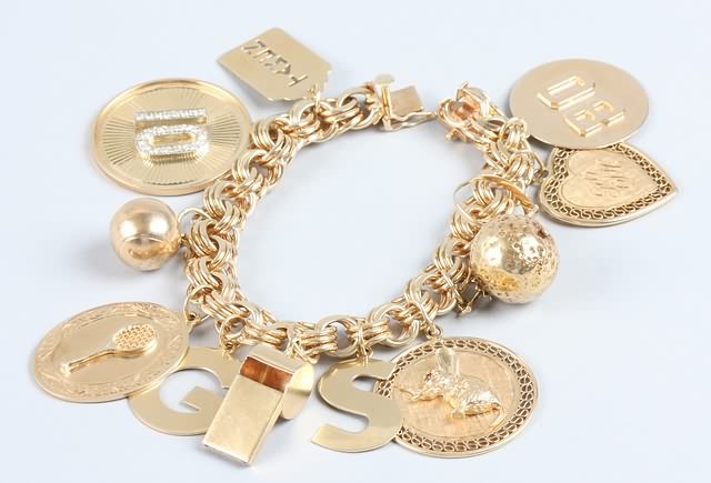 Appraisal: KY gold charm bracelet stamped K Gold weight grams single