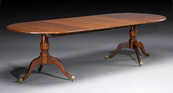 Appraisal: A George III style mahogany dining table partially incorporating antique