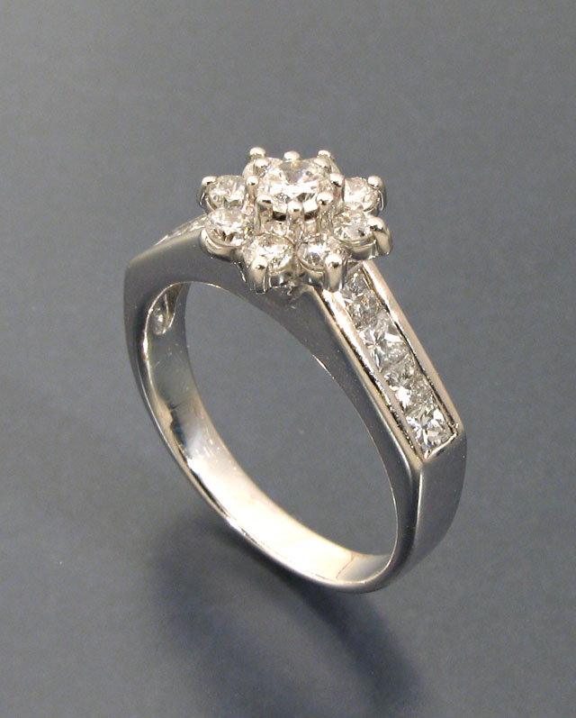 Appraisal: DIAMOND AND FOURTEEN KARAT WHITE GOLD RING set with nine