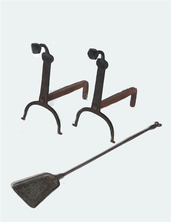 Appraisal: PAIR OF ANDIRONS AND SHOVEL American mid th century wrought