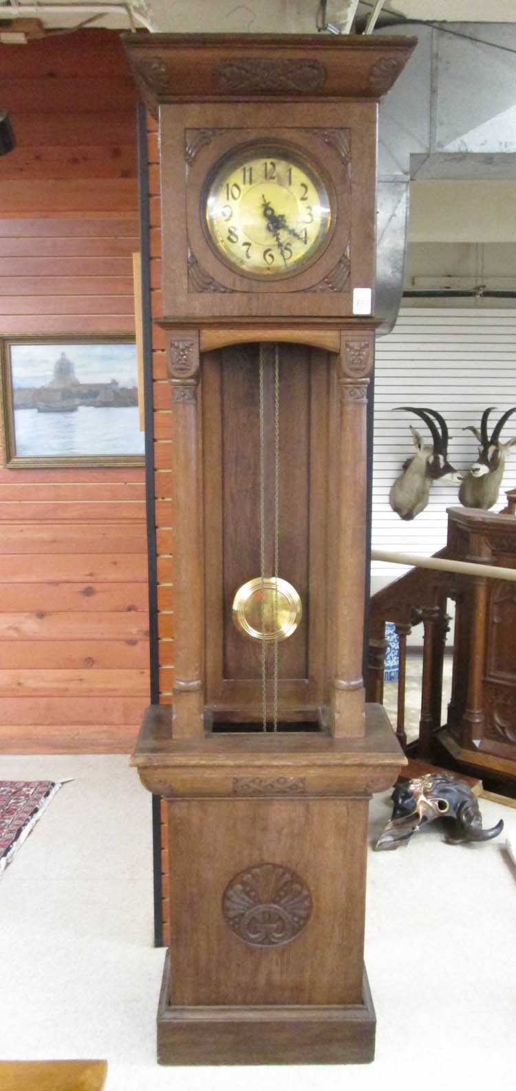 Appraisal: AN OAK OPEN-WELL TALL CASE FLOOR CLOCK Schlenker Kienzle Schwenningen