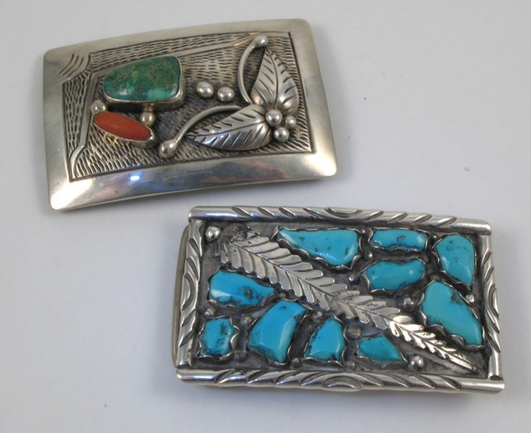 Appraisal: TWO NAVAJO STERLING SILVER BELT BUCKLES one with a Turquoise