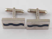 Appraisal: A pair of white metal tests silver enamel cufflinks x