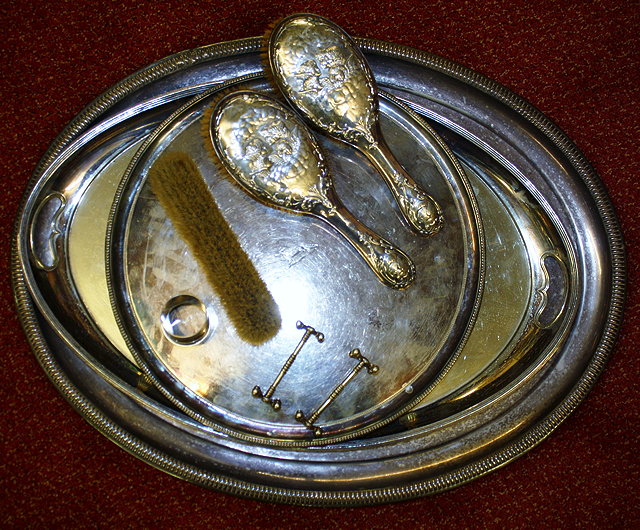 Appraisal: A PAIR OF SILVER HAIRBRUSHES with pressed cherub decoration Birmingham