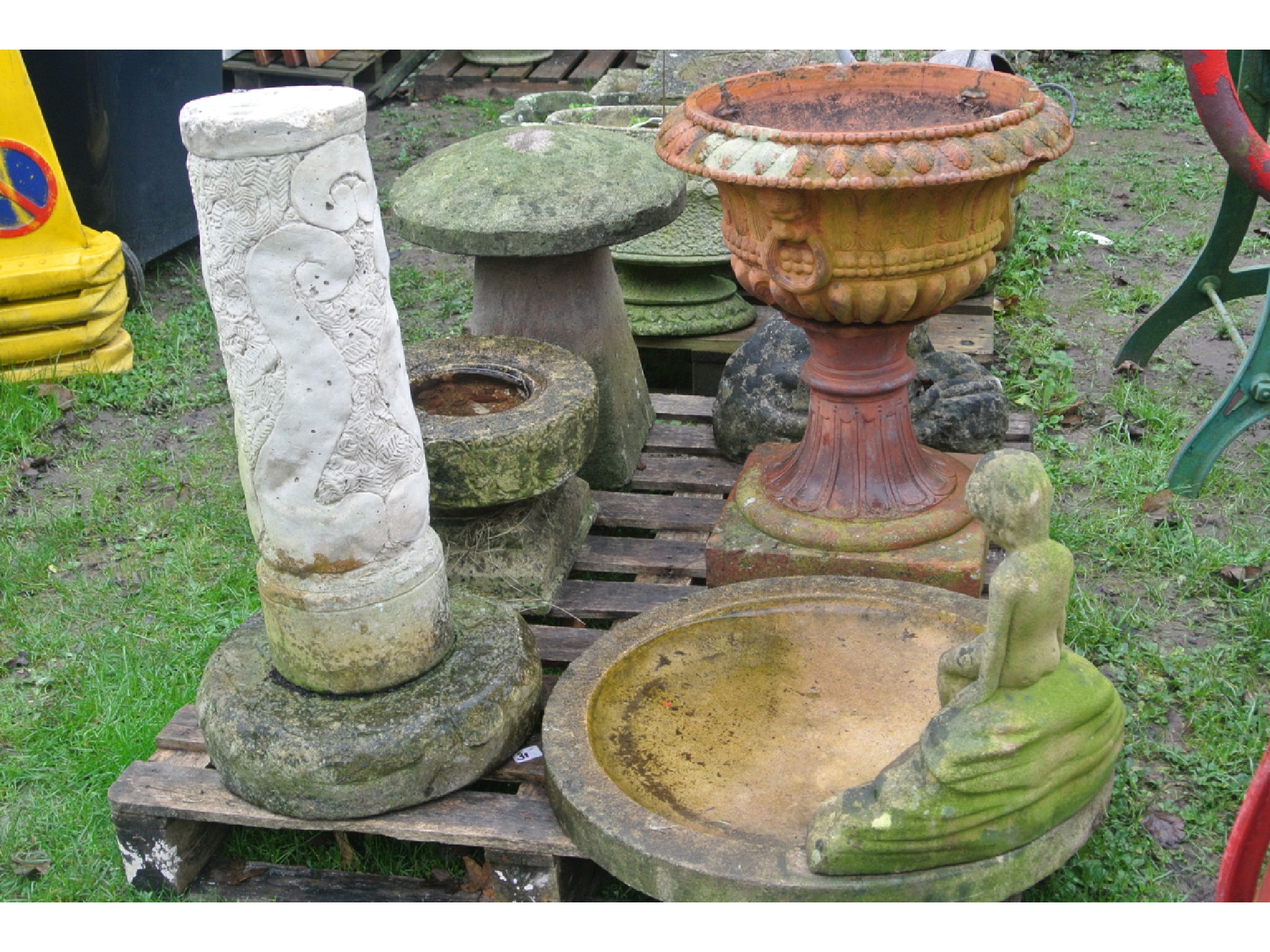 Appraisal: A terracotta garden urn the circular bowl with moulded leaf