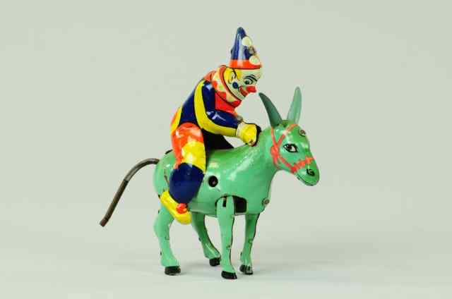 Appraisal: CLOWN ON DONKEY TOY Attributed to Einfelt Germany lithographed tin