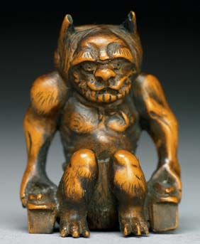 Appraisal: ANTIQUE BOXWOOD NETSUKE Antique carved boxwood netsuke of a muscular