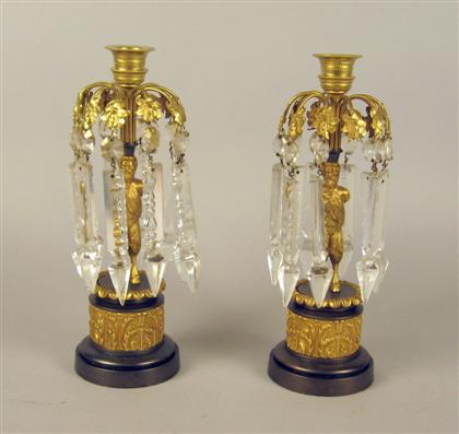 Appraisal: Two pairs of French gilt bronze candlesticks The first pair