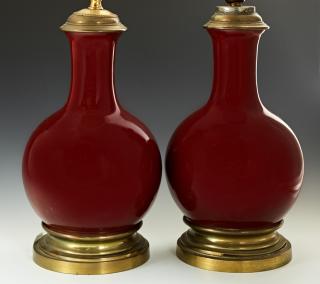 Appraisal: Pair of French Sangre de Boeuf Porcelain Lamps Pair of