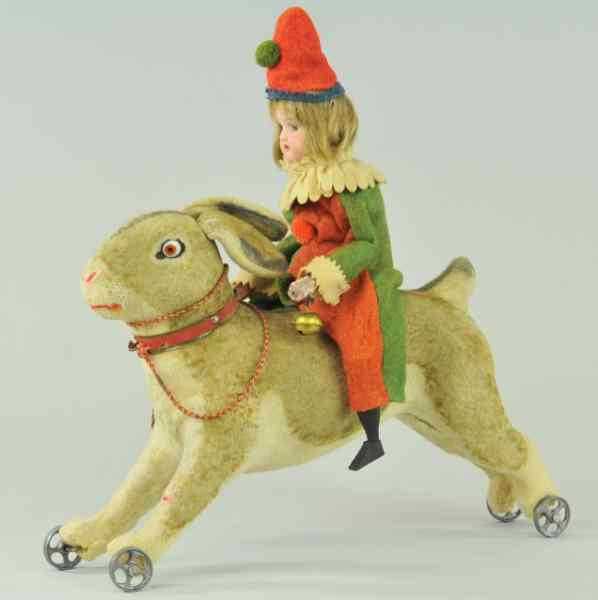 Appraisal: YOUNG BISQUE HEAD GIRL RIDING RABBIT Depicted in full felt