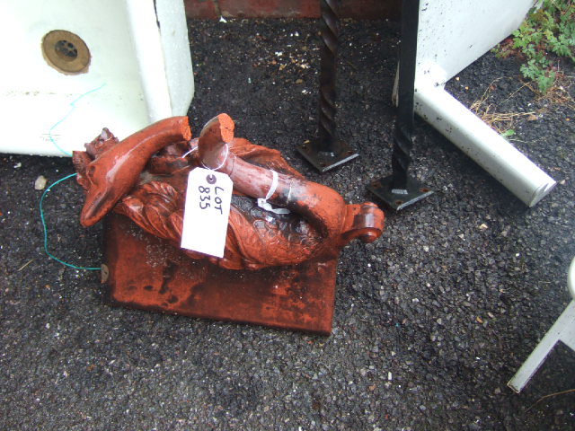 Appraisal: A terracotta roof finial ridge tile mounted with a swan