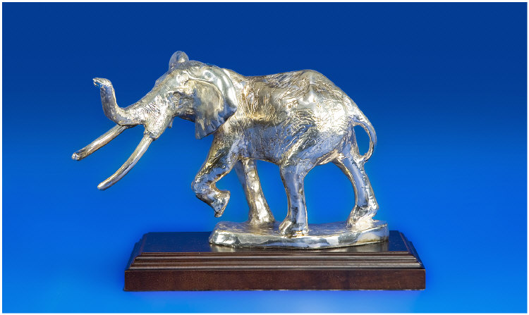 Appraisal: Silver Sculpture Realistically Modelled As An Elephant Captured In Movement