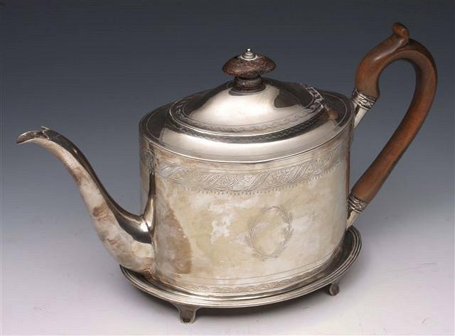 Appraisal: A GEORGE III SILVER TEA POT oval shaped with bright