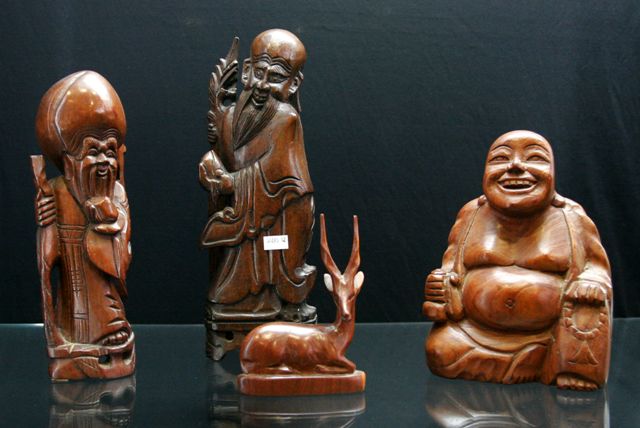 Appraisal: Fifteen Chinese and South East Asian wood carvings