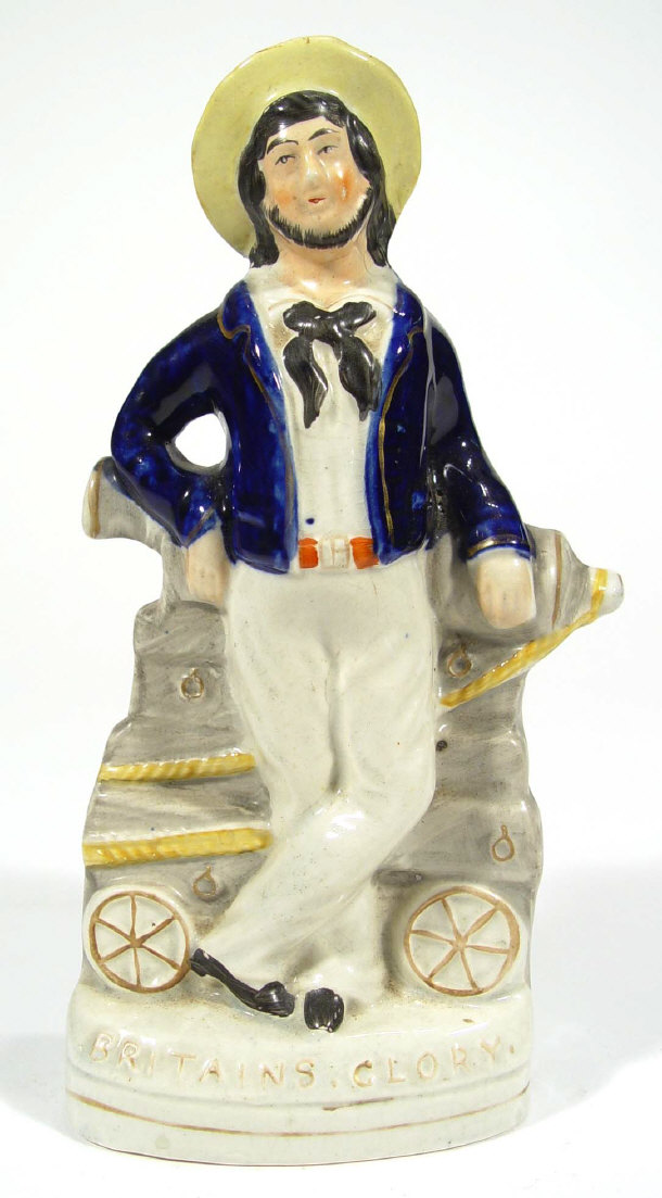 Appraisal: Victorian hand painted Staffordshire figure of a seaman before a