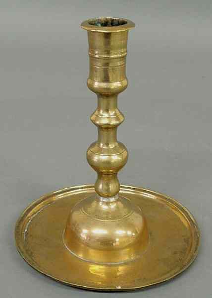 Appraisal: Uncommon early Continental brass candlestick c with a turned shaft