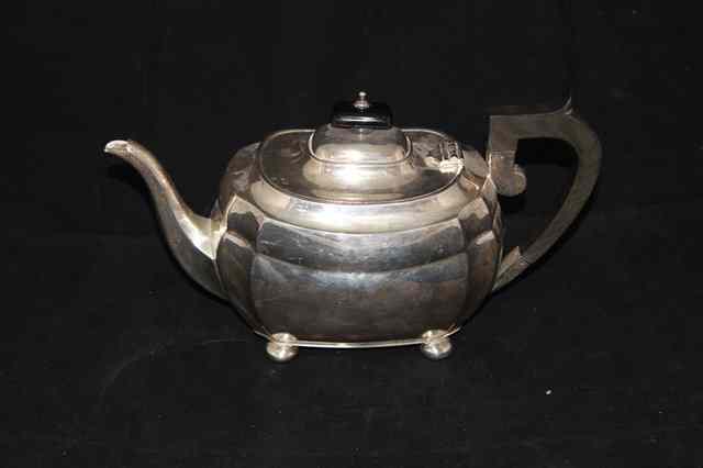 Appraisal: A THREE PIECE SILVER TEASET each piece standing on bun