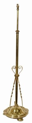 Appraisal: An adjustable brass standard lamp on a circular base to