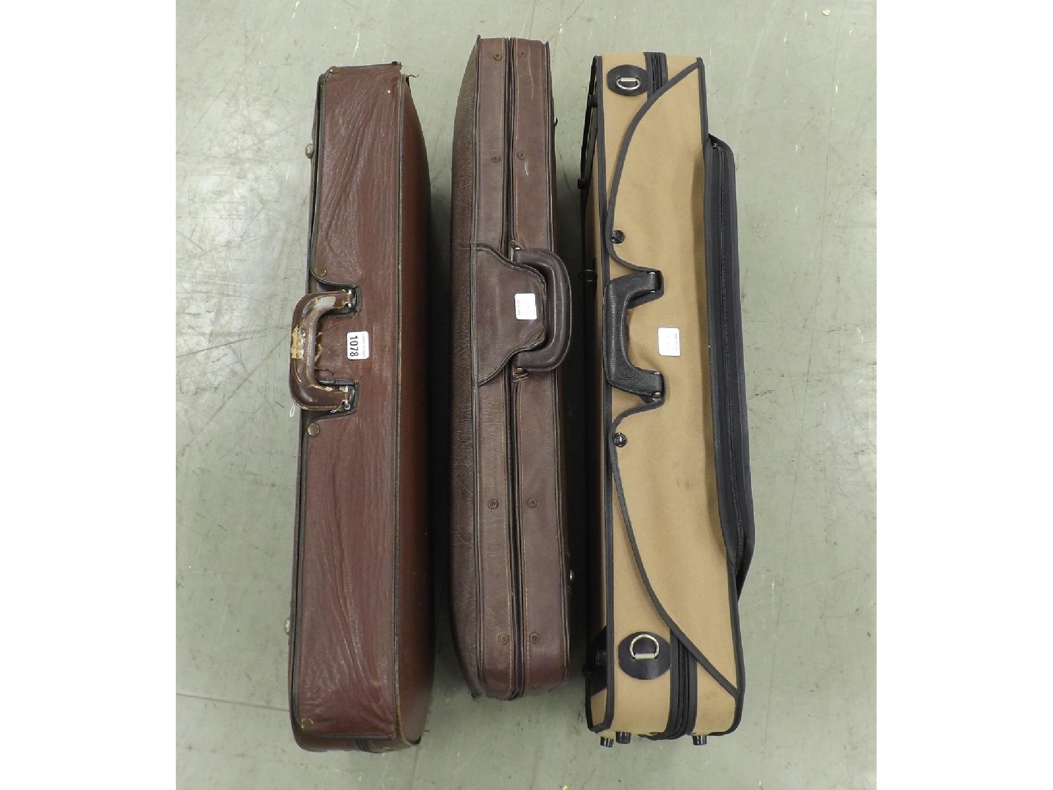 Appraisal: Three oblong violin cases with outer zipper covers