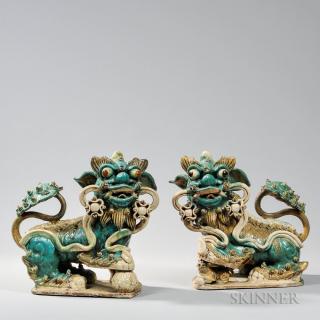 Appraisal: Pair of Glazed Pottery Shishi Lions Pair of Glazed Pottery