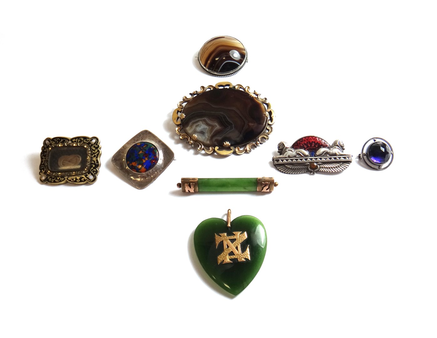 Appraisal: A Victorian oval banded agate set brooch decorated with a