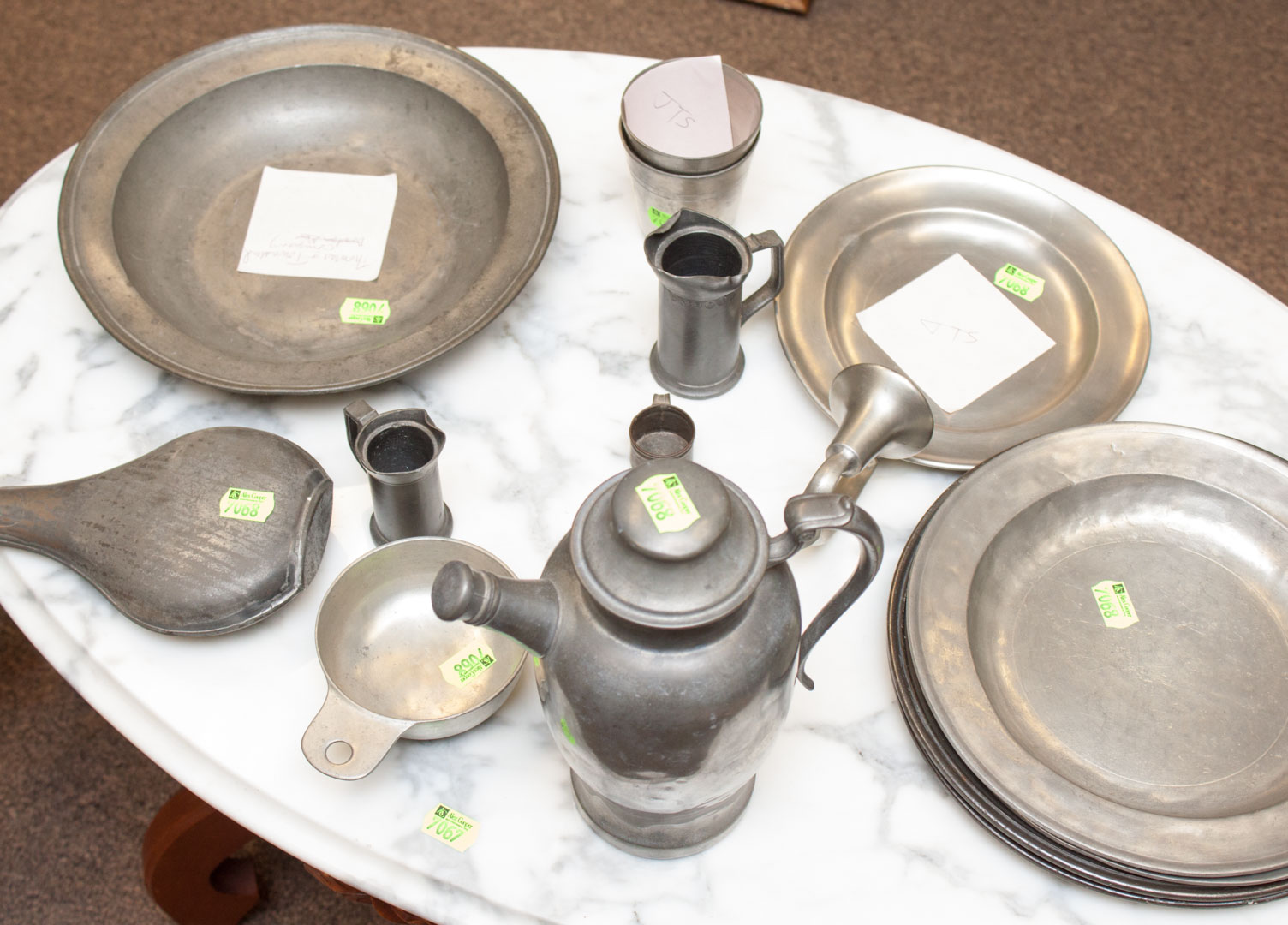 Appraisal: Assortment of pewter items including plates water pitcher measures flask