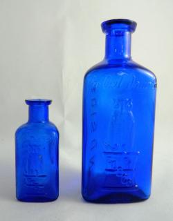 Appraisal: Poison bottles Poison- cobalt side ''Owl Drug co wing owl