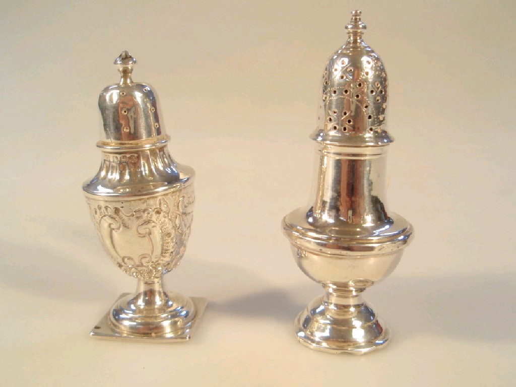 Appraisal: An Edwardian silver pepper pot with embossed decoration and another