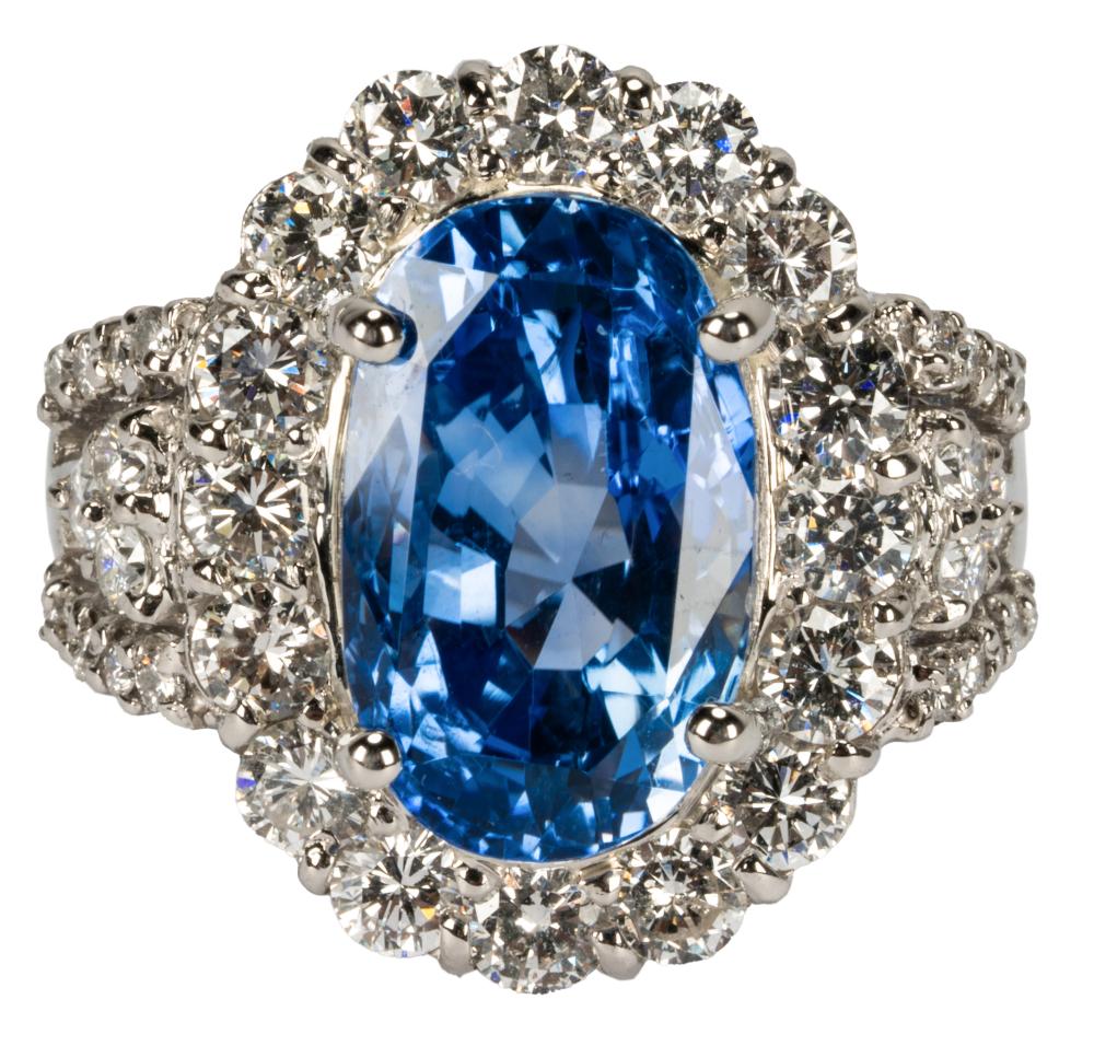 Appraisal: PLATINUM DIAMOND SAPPHIRE RINGcentering one oval sapphire weighing carats with