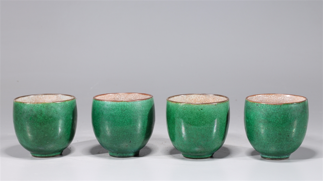 Appraisal: Four antique Chinese green crackle glazed ceramic cups th century