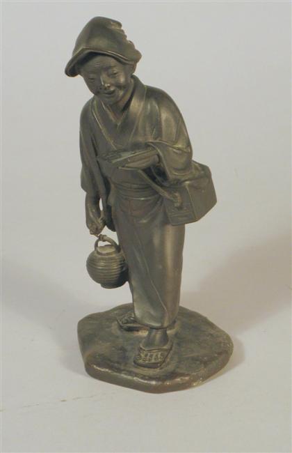 Appraisal: Japanese bronze figure Meiji period Small well-cast piece depicts cheerful