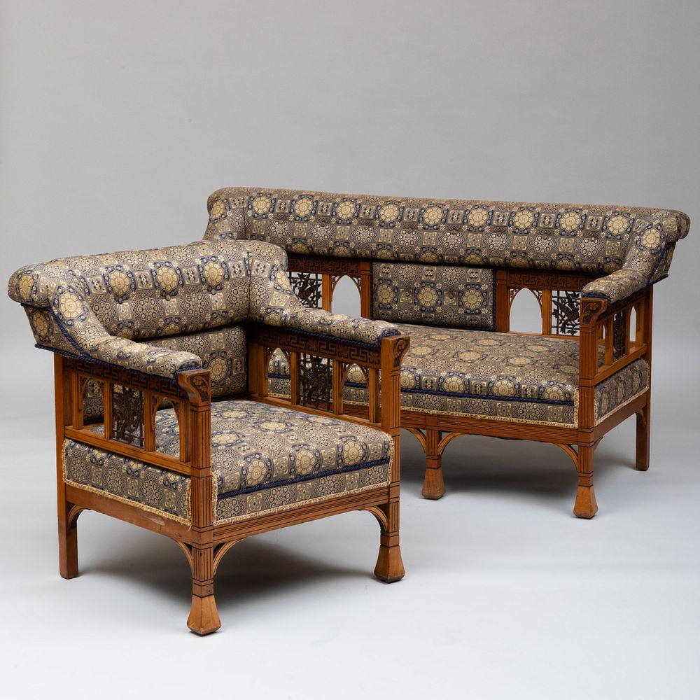 Appraisal: Aesthetic Movement Fruitwood and Ebonized Settee and Armchair The sofa