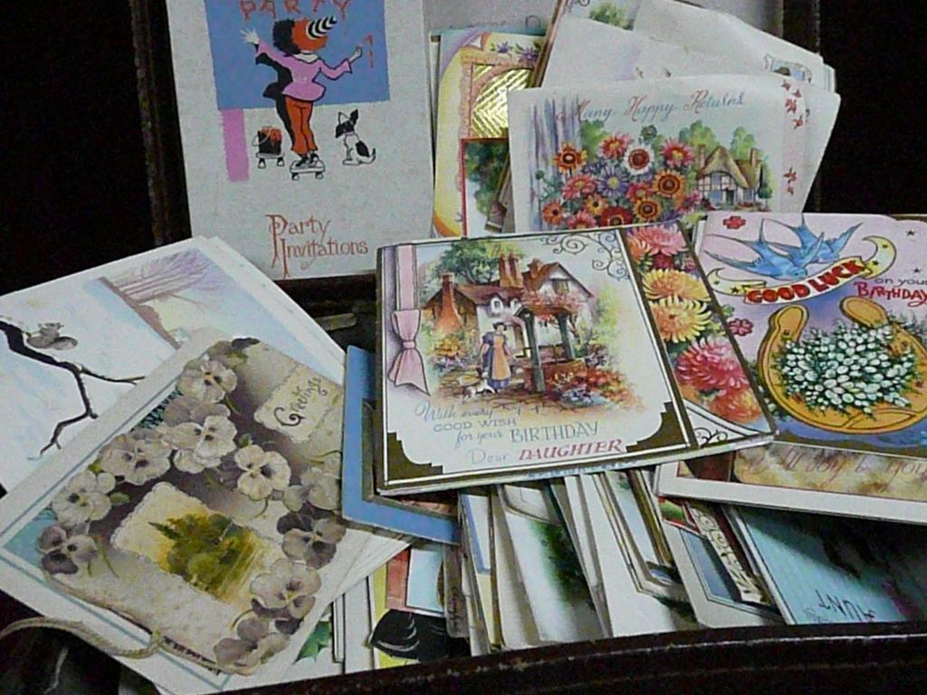 Appraisal: A small suitcase containing vintage greetings cards and party invitations