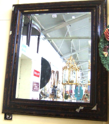 Appraisal: A late th century tortoiseshell veneered cushion framed wall mirror