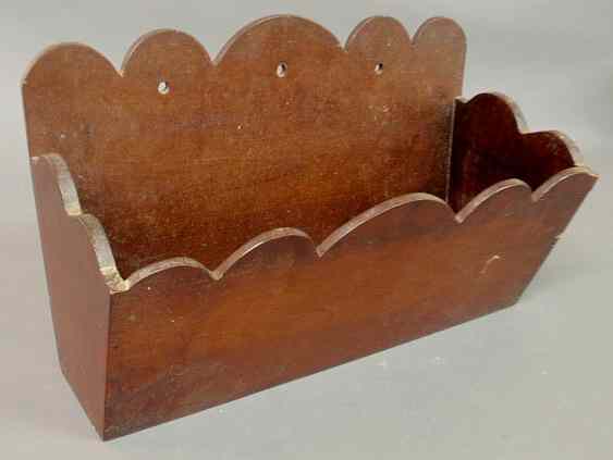 Appraisal: Mahogany wall pocket with scalloped carved edges h x w