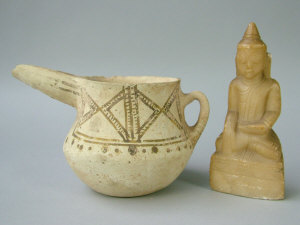 Appraisal: An Antique near Eastern pottery ewer the cream ground with