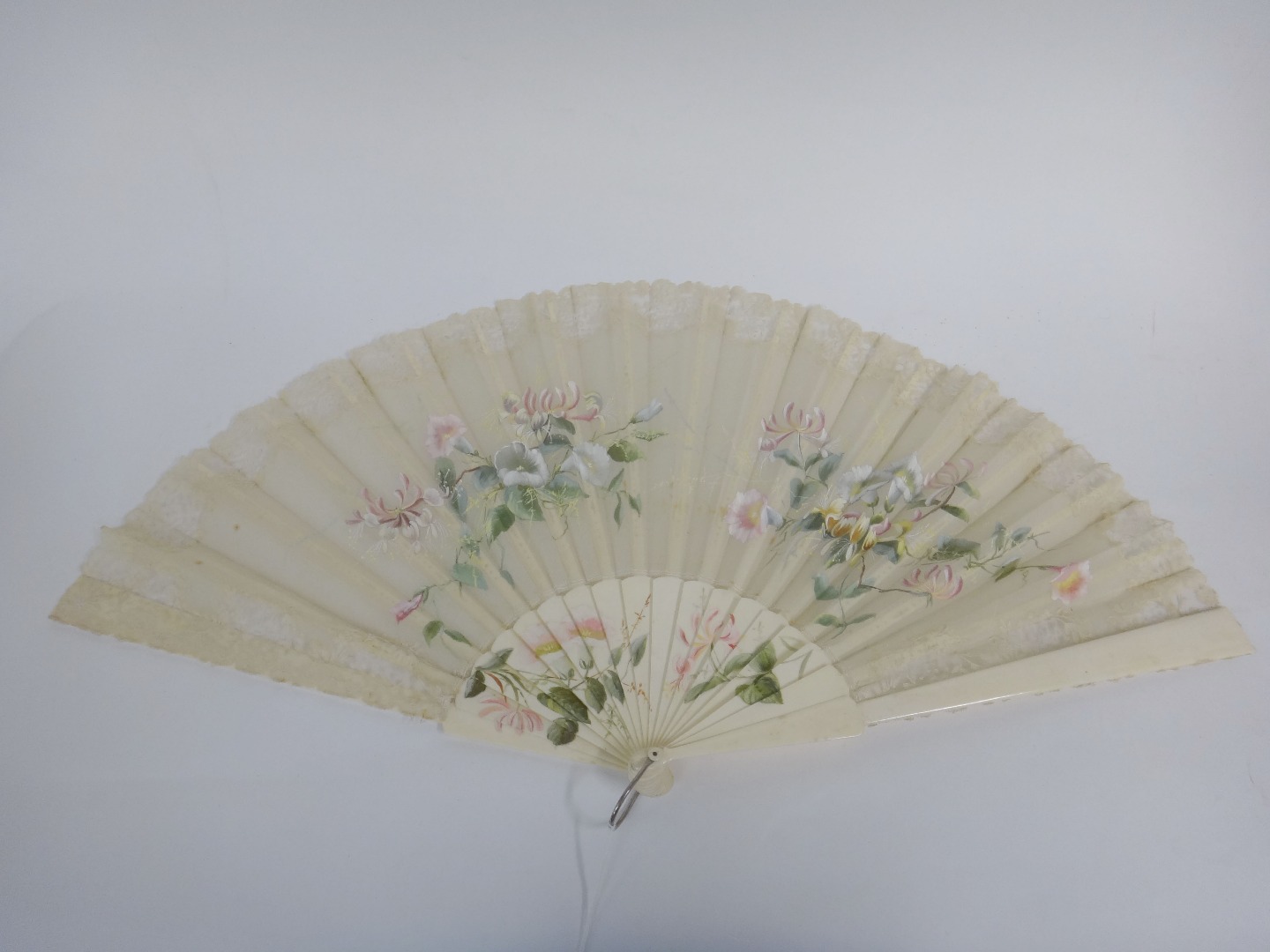 Appraisal: A late th century fan with painted and lace edged