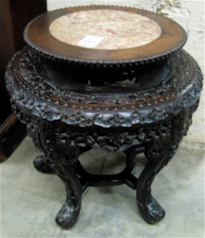 Appraisal: RELIEF-CARVED ROSEWOOD PEDESTAL TABLE Chinese early th century having a