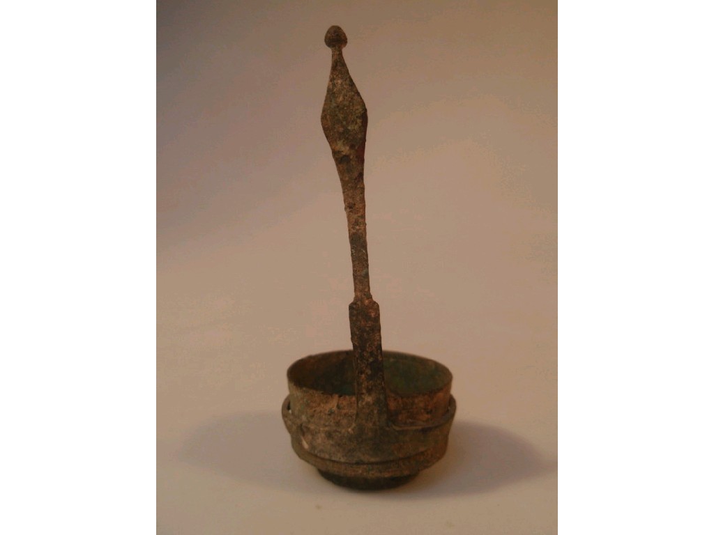 Appraisal: A Roman cast bronze ladle or simpulum the cylindrical body