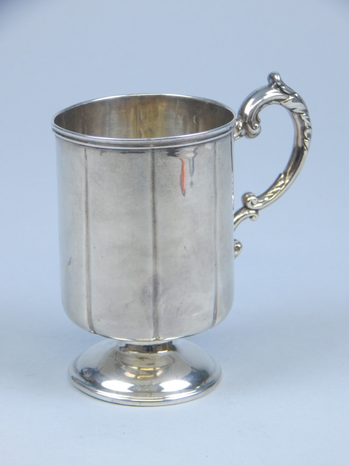 Appraisal: A Victorian silver christening mug of ribbed cylindrical form with