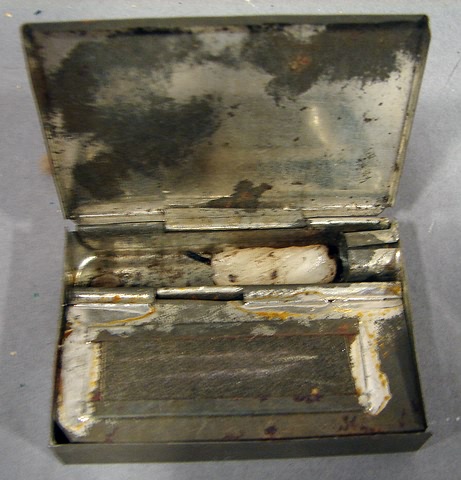 Appraisal: Tin trench candle holder and match safe