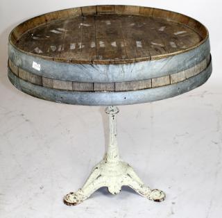 Appraisal: French wine barrel end bistro table on cast iron pedestal