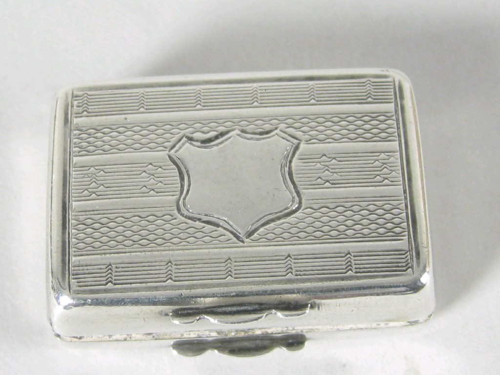 Appraisal: A Victorian rectangular Vinaigrette with engine turning and vacant shield