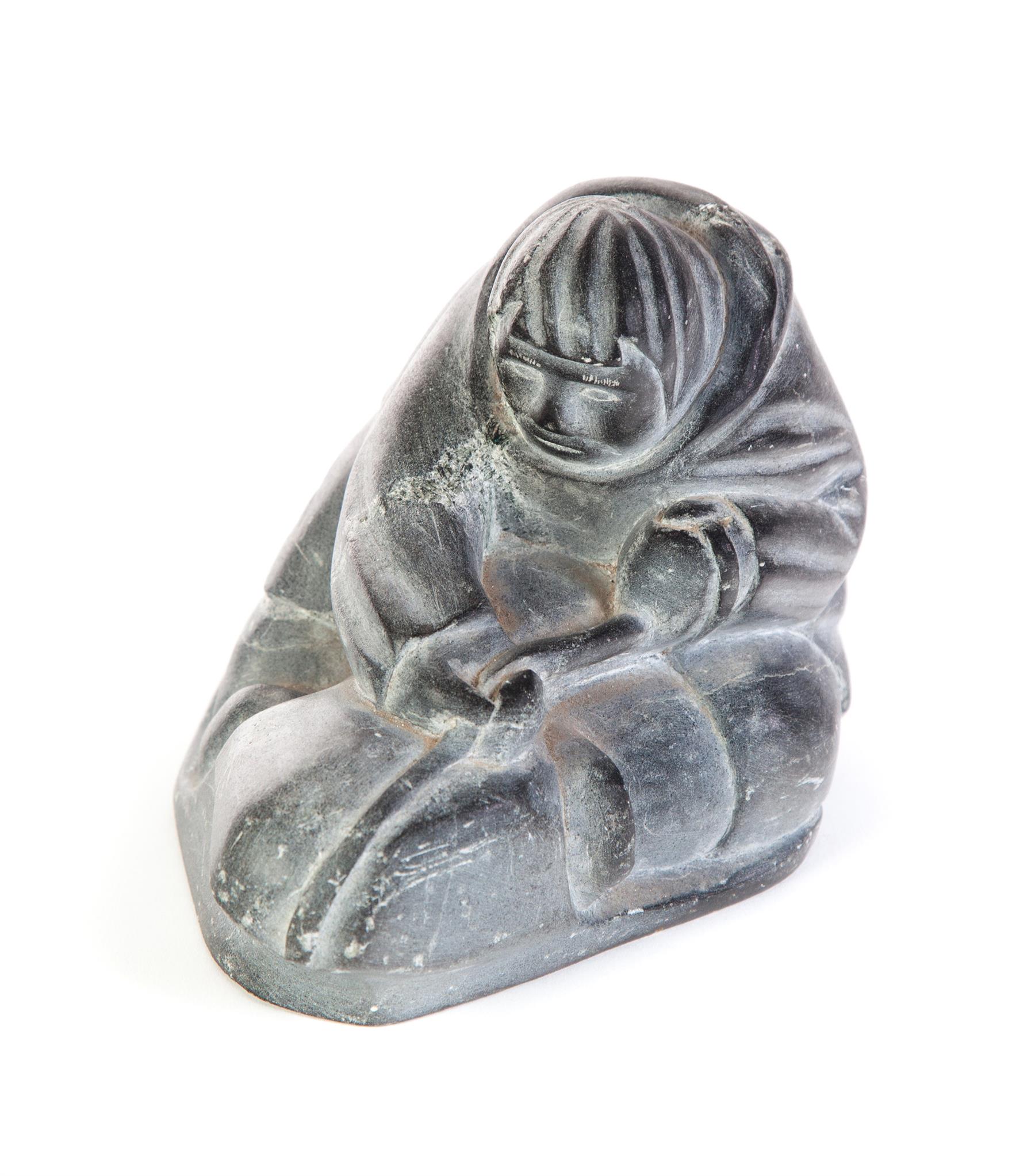 Appraisal: INUIT CARVING OF ICE FISHERMAN Twentieth century hardstone Seated man